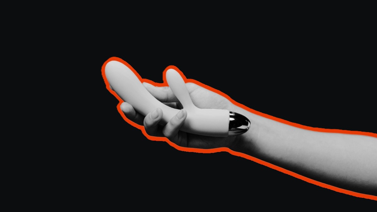 A hand holding an advanced double-ended vibrator.